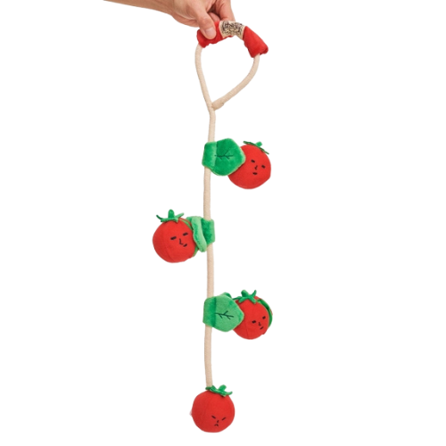 Cherry tomato-shaped dog toy with tug rope, squeaker, and treat pockets