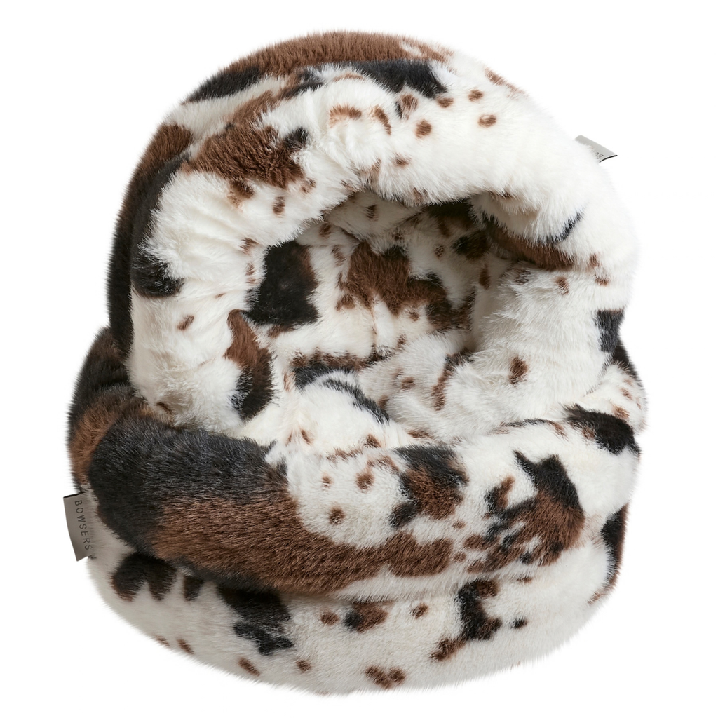 Both sizes of Bowsers Muffy Nesting Dog Bed in Longhorn taupe faux fur